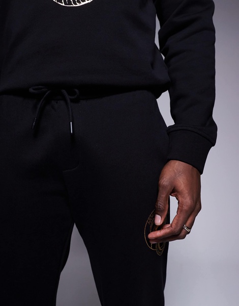 Armani Exchange lunar capsule snake sweatpants in black