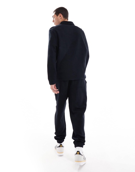 ASOS DESIGN tapered rib sweatpants in black