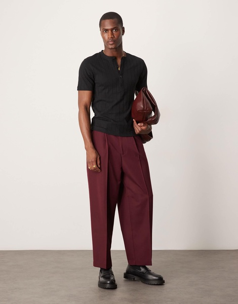 ASOS DESIGN muscle fit ribbed T-shirt with henley neck in black