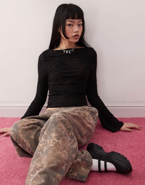 Reclaimed Vintage flared sleeve zebra animal burnout top in black