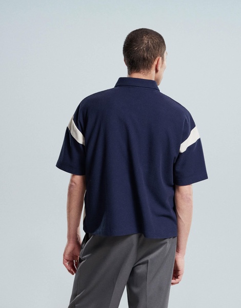ASOS DESIGN boxy heavyweight 230gsm waffle texture oversized polo with paneling and chest print in navy