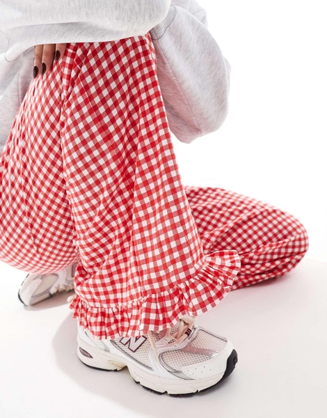 ASOS DESIGN gingham pants with frill hem in red