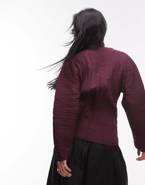ARKET plisse top with sculptural sleeves in burgundy