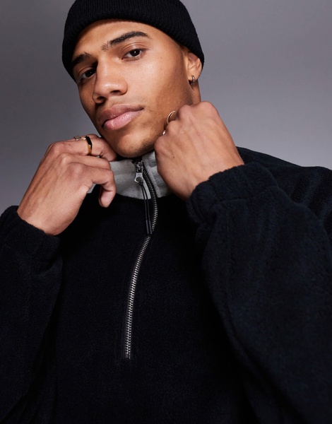 ASOS DESIGN oversized fleece sweatshirt with quarter zip and pocket in black