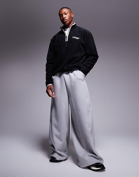 ASOS DESIGN boxy oversized fleece quarter zip sweatshirt with contrast binding and print in black