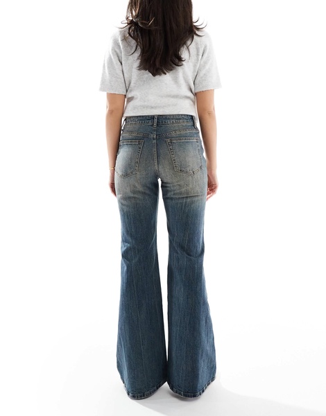 Bershka flared jeans in dirty wash blue