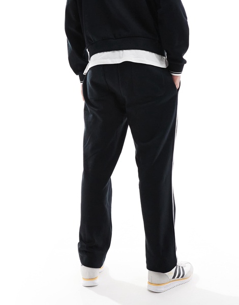 ASOS DESIGN straight leg sweatpants with textured side stripes in black