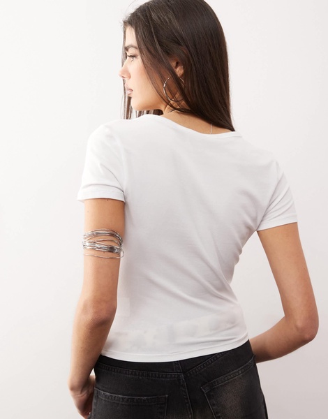 Monki shrunken fit baby tee with bra graphic in white