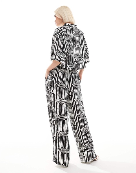ASOS DESIGN straight leg pull on pants in black and white print - part of a set