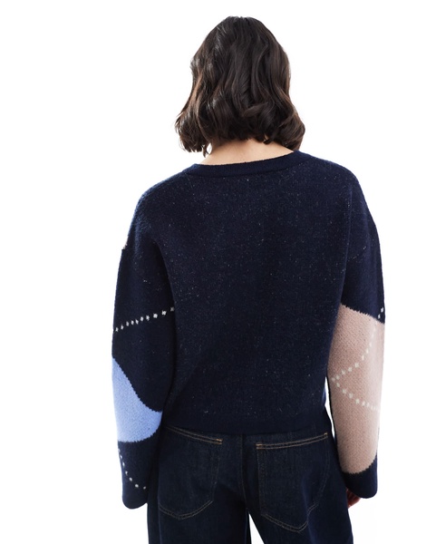 ASOS DESIGN knitted crew neck cardigan with gold button in navy argyle pattern