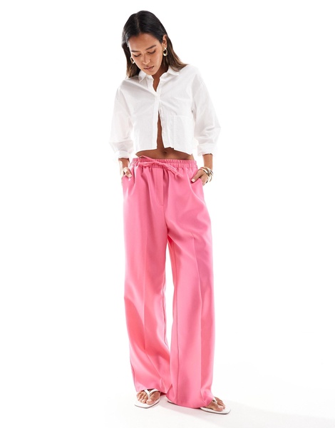 ASOS DESIGN tailored pull on pants in pink
