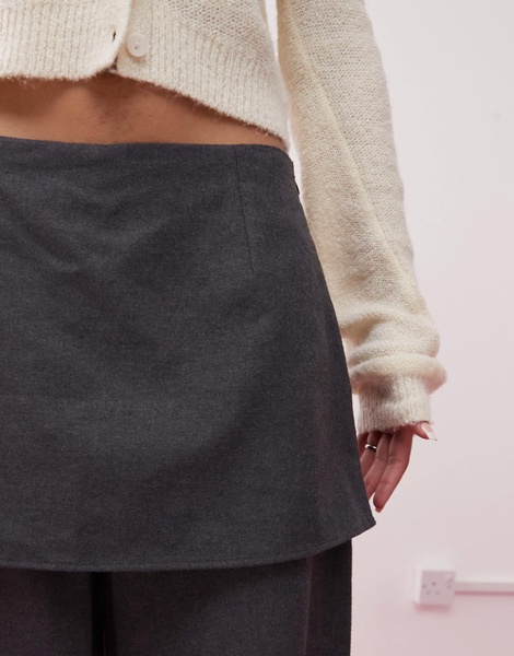 Reclaimed Vintage mini skirt over pants in gray