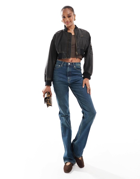 ASOS DESIGN Tall mid rise flare jeans in dark tinted blue