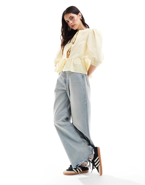 ASOS DESIGN cotton poplin tie front peplum blouse in pastel buttermilk