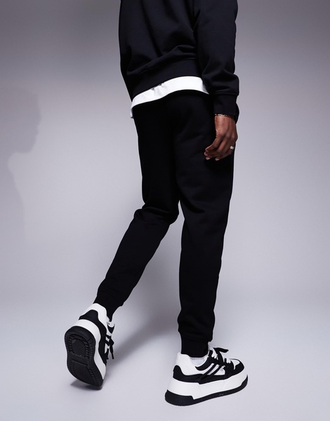 Armani Exchange lunar capsule snake sweatpants in black