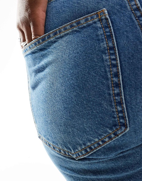 ASOS DESIGN mid rise straight jeans in mid blue