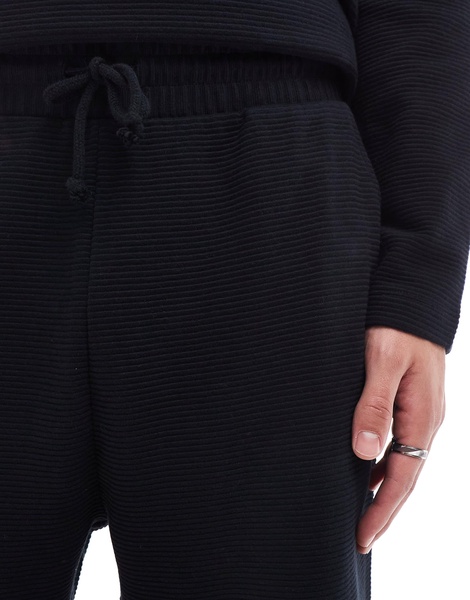 ASOS DESIGN tapered rib sweatpants in black