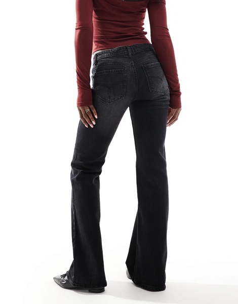 Bershka low rise flared jeans in black