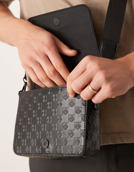 ASOS DESIGN crossbody bag with monogram emboss detail in black faux leather