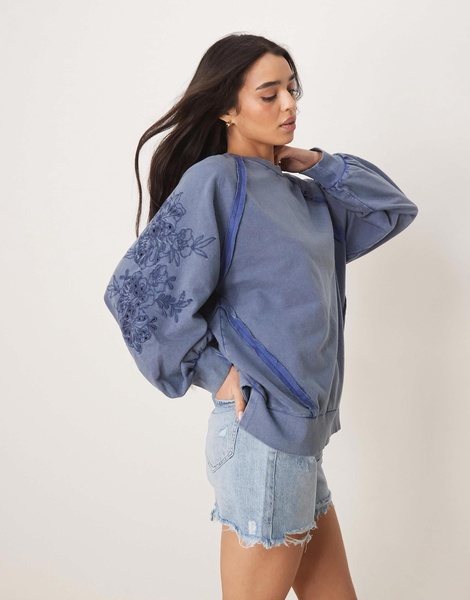 ASOS DESIGN oversized sweat with seam detail and cutwork sleeves in washed blue