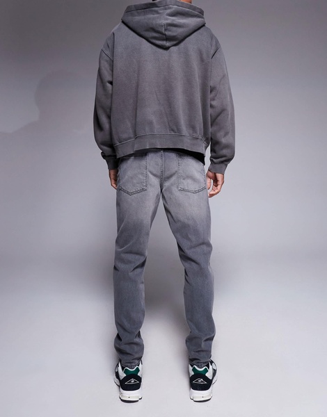 ASOS DESIGN tapered fit jeans in washed black