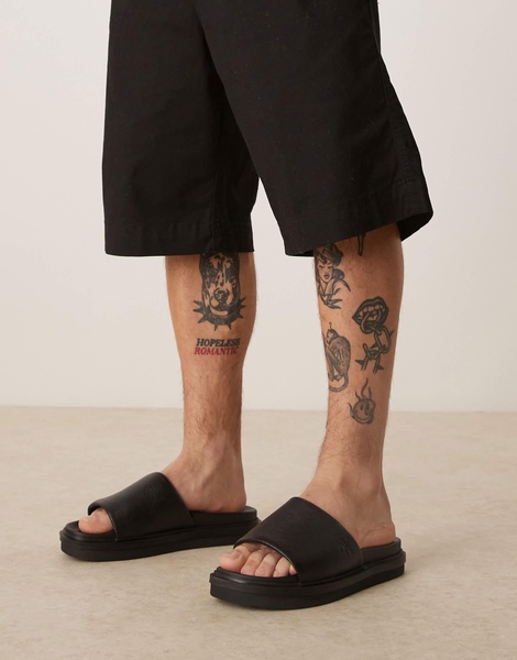 Calvin Klein Jeans embossed slide sandals in black