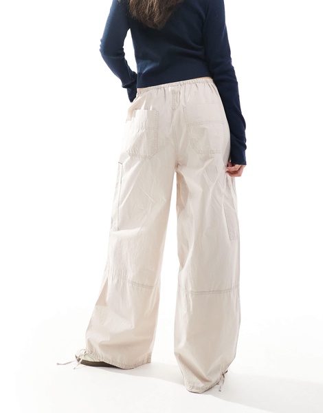 ASOS DESIGN pants with tie hems and clean utility pockets in stone