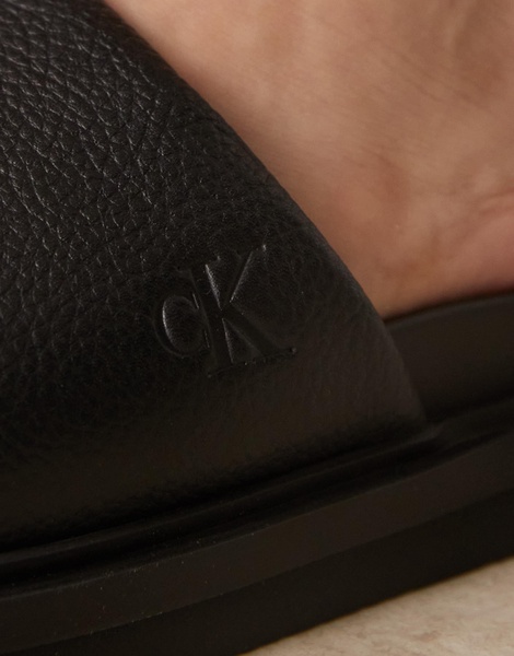 Calvin Klein Jeans embossed slide sandals in black