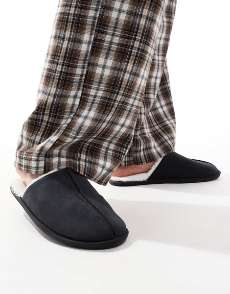 ASOS DESIGN mule slippers in black with faux shearling lining