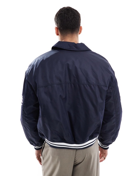 Bershka retro sports bomber jacket in blue