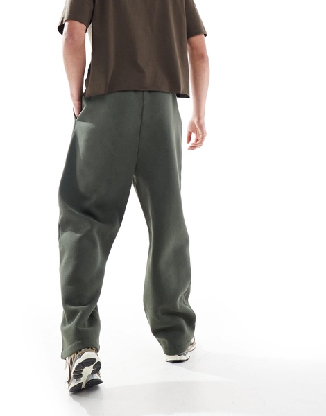 ASOS DESIGN wide leg sweatpants with pocket details in washed green