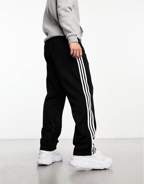 adidas Originals Adicolor firebird track pants in black & white