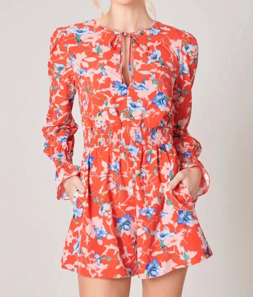 by the bay tropical print long sleeve romper in red multi floral print