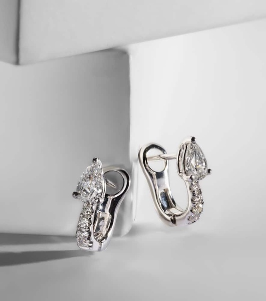 18kt white gold huggies with diamonds