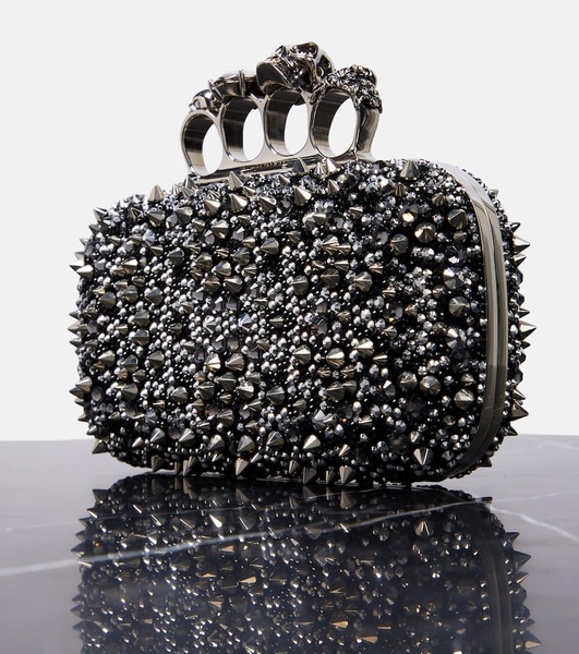 Knuckle embellished leather clutch
