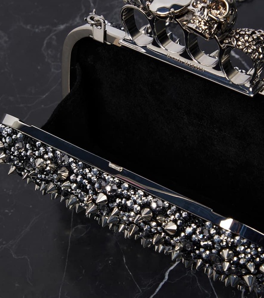 Knuckle embellished leather clutch