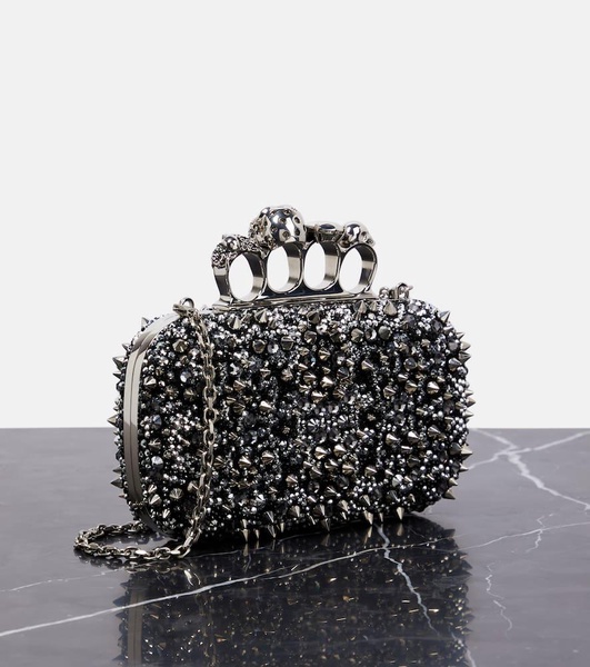 Knuckle embellished leather clutch