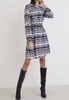 long sleeve smocked mini dress in rustic stripe