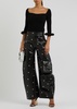 Stud-embellished faux leather trousers