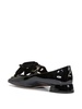 Black ballet flats with a heart-shaped neckline