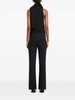 Black sleeveless turtleneck blouse by Courrèges