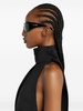 Black sleeveless turtleneck blouse by Courrèges