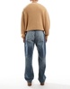 ASOS DESIGN baggy jeans in mid wash with abrasions