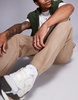 ASOS DESIGN tapered fleece sweatpants in brown