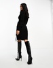 Vero Moda Petite wrap belted long sleeve knitted mini dress in black