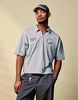 ASOS DESIGN boxy oversized zipped polo with sports graphic in gray heather rib