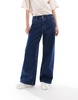 ASOS DESIGN slouchy wide leg jeans in mid blue