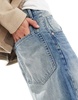 Bershka super baggy fit jeans in washed blue