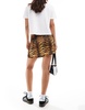 ASOS DESIGN wrap satin mini skirt in animal print