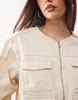 Monki utility jacket with zip off sleeves in beige
